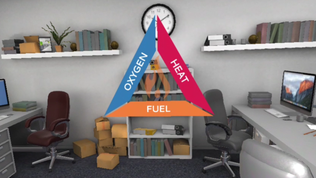 Fire Safety Virtual Reality Training For Employees, office environment with desks, chairs, shelves and stacked up card board boxes, overlaid with an oxygen-heat-fuel triangle graphic