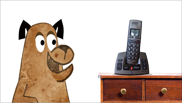 Animated Still of a Dog Looking at a Phone on a Cabinet