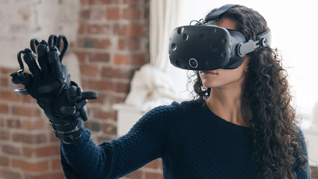 medium shot of Woman Wearing VR Headset And Haptic Gloves