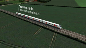 wide vide of a battery powered train travelling across a country landscape with text - travelling up to 90km just on batteries