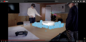 Two people using the Microsoft HoloLens