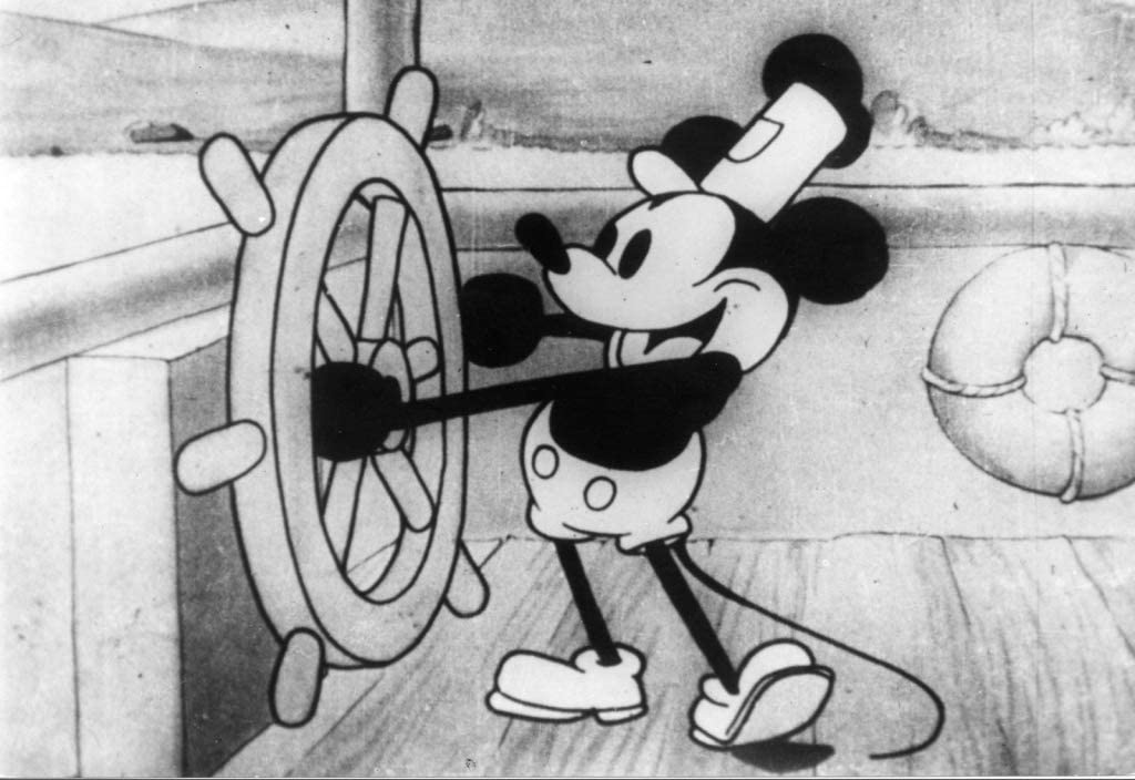 Still from 'Steamboat Willie' of Micky Mouse steering a boat