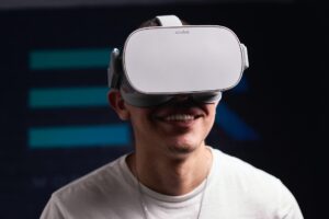 man smilling in oculus vr headset