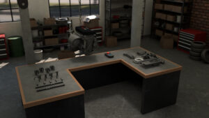 A VR environment of a car garage with a table in the centre and an engine hanging from the ceiling