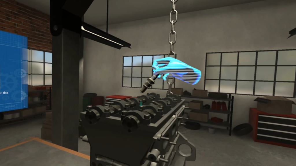 VR simulation scene showing a realistic workshop environment with an engine block on a workbench. A glowing blue holographic hand hovers above, guiding the placement of a spark plug—illustrating a haptic-enabled virtual reality training experience for engine assembly.