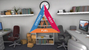 A VR office environment with a graphic of a 'fire triangle' symbol in the centre