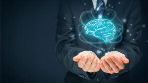 illustration of a blue brain floating above human hands
