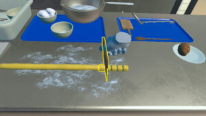 A screengrab from the VR Cooking training of the user cutting gnocchi dough