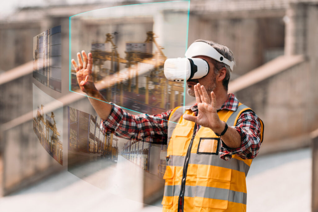 A construction worker with a VR headset on looking at various images of construction sites in VR