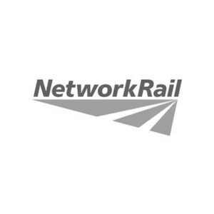 Grayscale logo of Network Rail featuring the words “NETWORK RAIL” in uppercase sans-serif alongside a stylised triangular graphic representing diverging rail tracks.