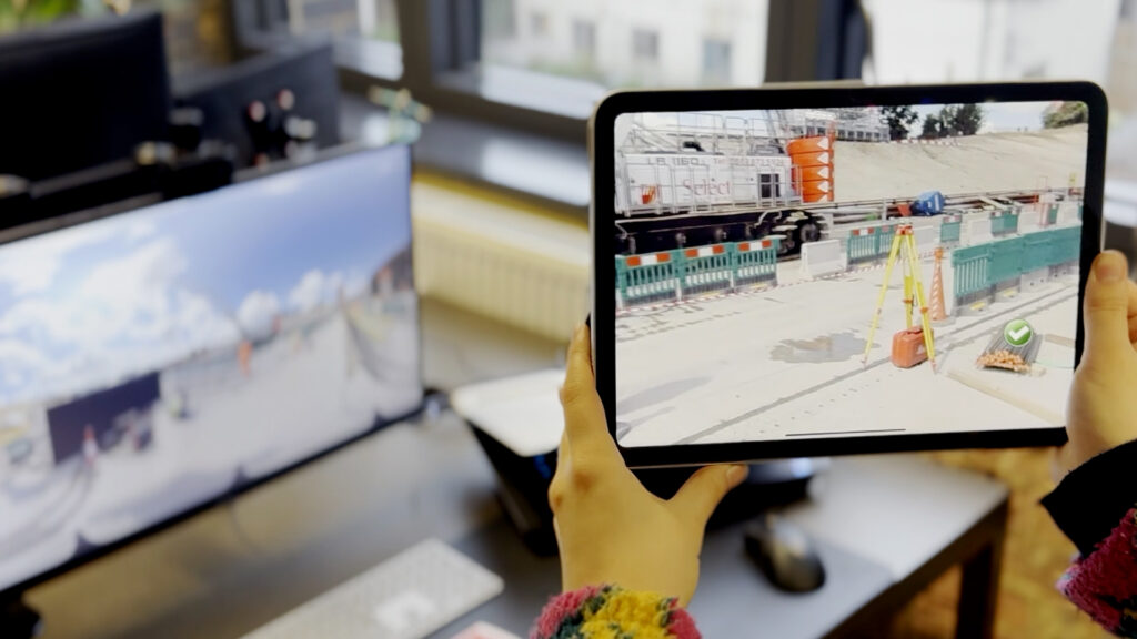tablet displaying AR construction training, overlaying hazard awareness training visuals onto a real site environment to support safety training
