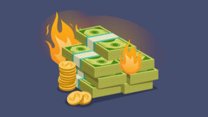 Illustration of stacks of cash and gold coins surrounded by flames, symbolising wasted budget, financial loss, rising costs, or inefficient spending.